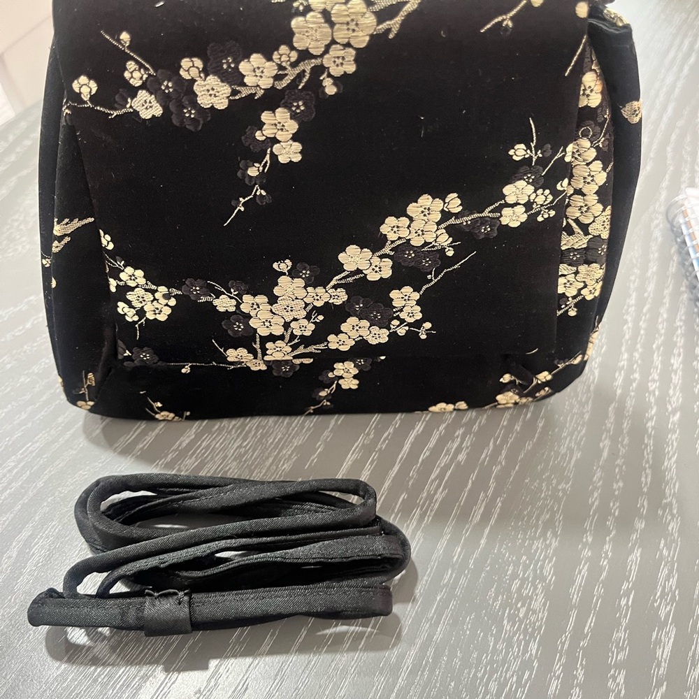 “Midnight Blossom “  Cache Black and Gold Floral Crossbody Bag